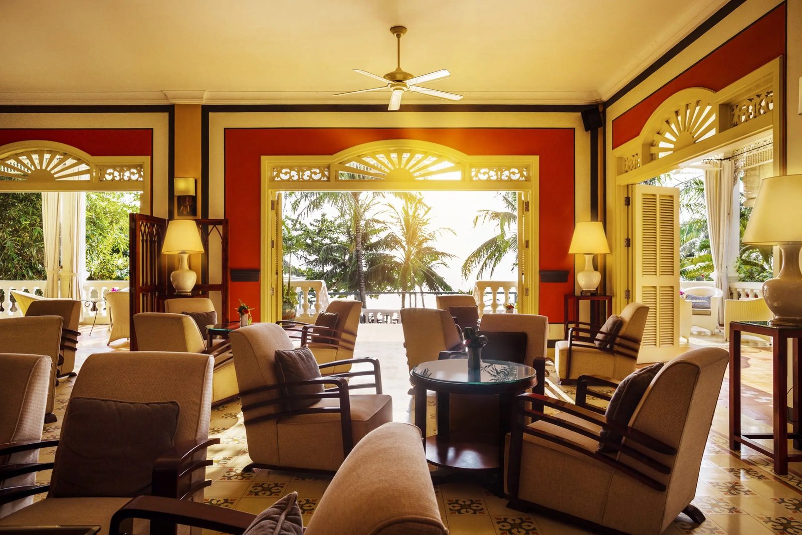 The Indochine colonial lounge at La Veranda Resort, Phú Quốc, opening onto palms and the sea